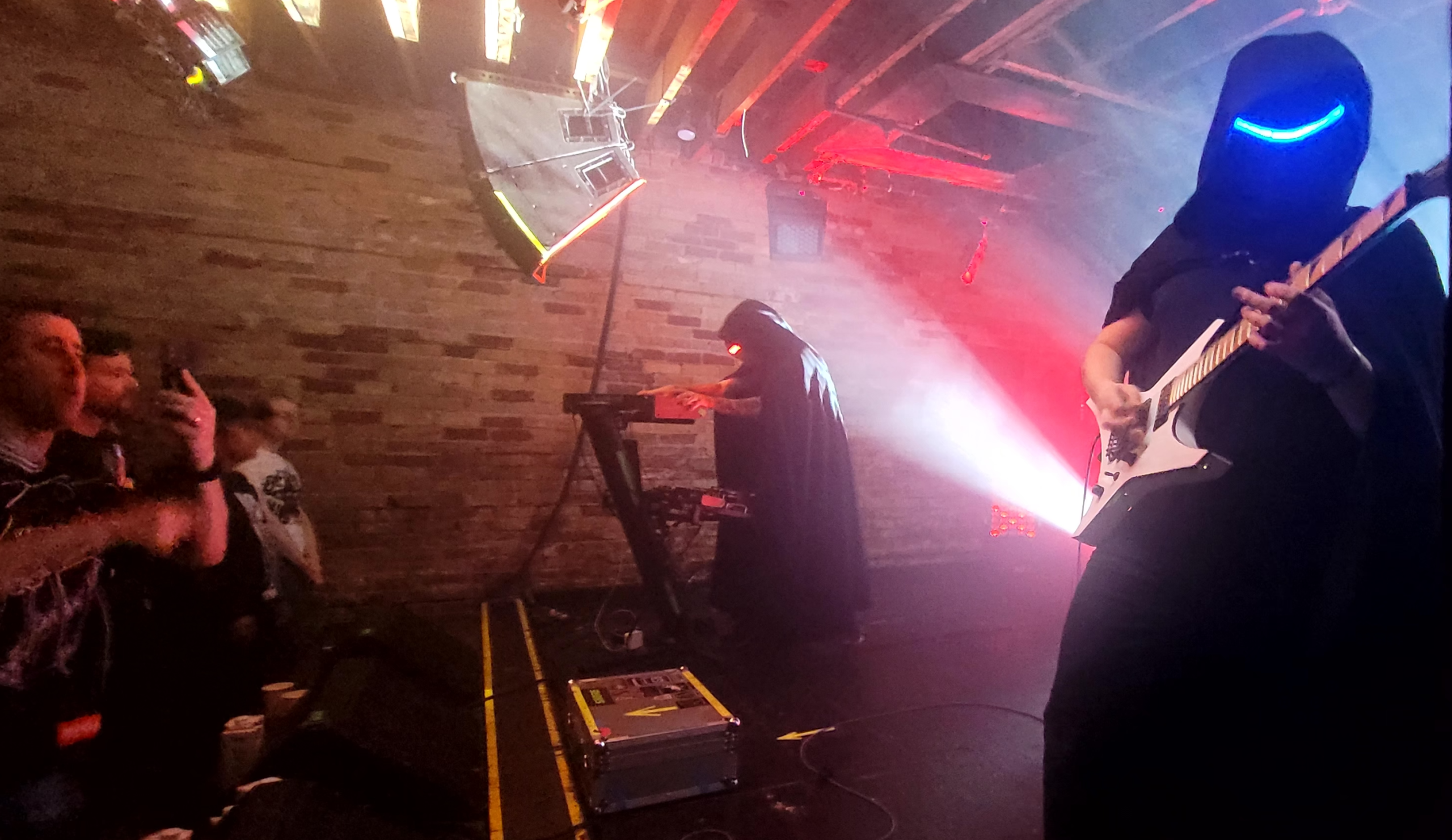Magic Sword 2025 Music performance in a dark space, the performer's masks hide their faces