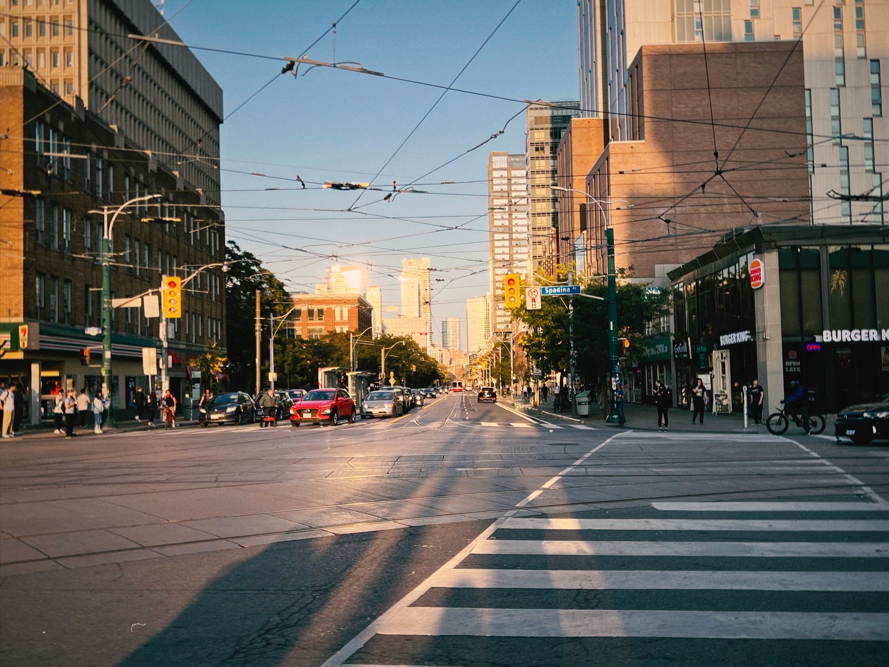 web of tram overhead lines over the intersection of a large city